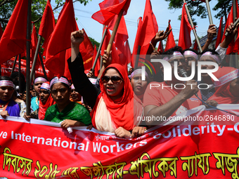 Bangladeshi garment workers and other labor organization members take part in a rally to mark May Day, International Workers' Day in Dhaka,...