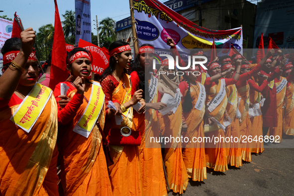 Bangladeshi garment workers and other labor organization members take part in a rally to mark May Day, International Workers' Day in Dhaka,...