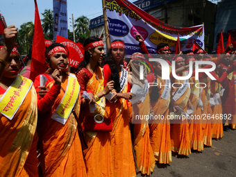 Bangladeshi garment workers and other labor organization members take part in a rally to mark May Day, International Workers' Day in Dhaka,...