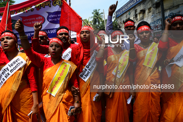 Bangladeshi garment workers and other labor organization members take part in a rally to mark May Day, International Workers' Day in Dhaka,...