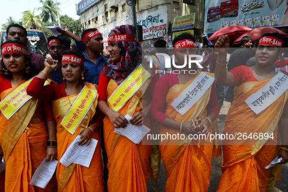 Bangladeshi garment workers and other labor organization members take part in a rally to mark May Day, International Workers' Day in Dhaka,...