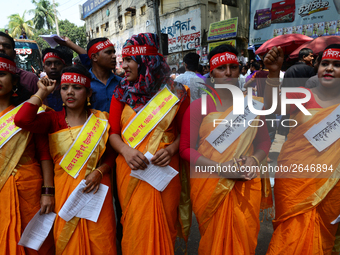 Bangladeshi garment workers and other labor organization members take part in a rally to mark May Day, International Workers' Day in Dhaka,...