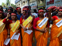 Bangladeshi garment workers and other labor organization members take part in a rally to mark May Day, International Workers' Day in Dhaka,...