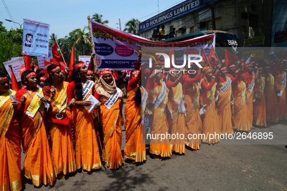 Bangladeshi garment workers and other labor organization members take part in a rally to mark May Day, International Workers' Day in Dhaka,...