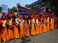 Bangladeshi garment workers and other labor organization members take part in a rally to mark May Day, International Workers' Day in Dhaka,...