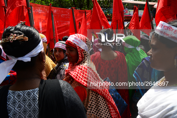 Bangladeshi garment workers and other labor organization members take part in a rally to mark May Day, International Workers' Day in Dhaka,...