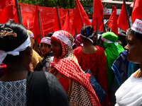 Bangladeshi garment workers and other labor organization members take part in a rally to mark May Day, International Workers' Day in Dhaka,...