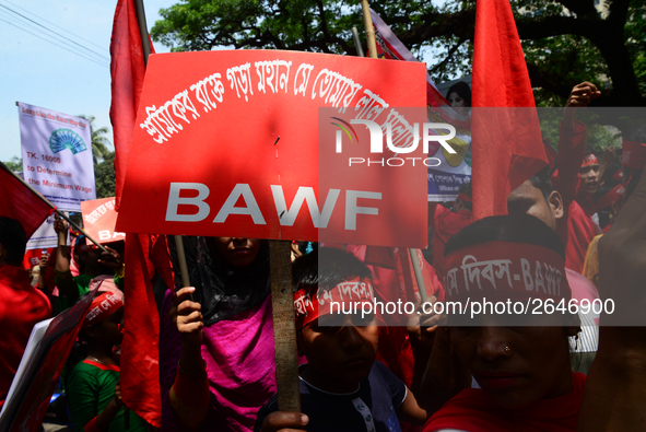 Bangladeshi garment workers and other labor organization members take part in a rally to mark May Day, International Workers' Day in Dhaka,...