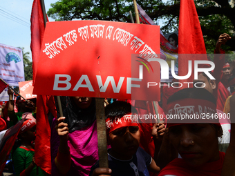 Bangladeshi garment workers and other labor organization members take part in a rally to mark May Day, International Workers' Day in Dhaka,...