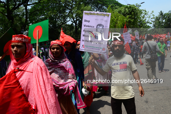 Bangladeshi garment workers and other labor organization members take part in a rally to mark May Day, International Workers' Day in Dhaka,...