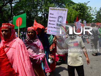 Bangladeshi garment workers and other labor organization members take part in a rally to mark May Day, International Workers' Day in Dhaka,...