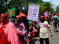 Bangladeshi garment workers and other labor organization members take part in a rally to mark May Day, International Workers' Day in Dhaka,...