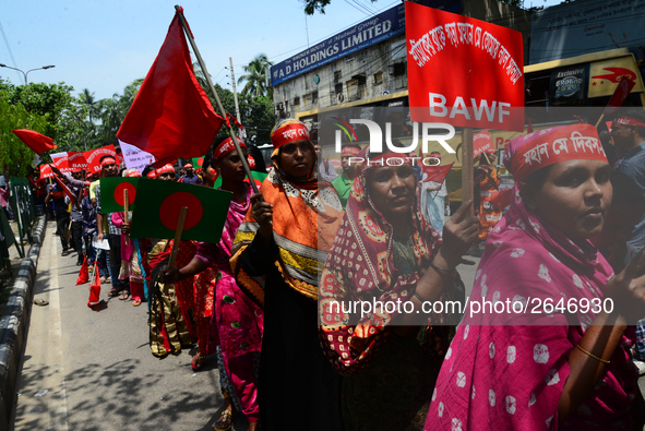 Bangladeshi garment workers and other labor organization members take part in a rally to mark May Day, International Workers' Day in Dhaka,...