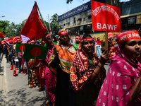 Bangladeshi garment workers and other labor organization members take part in a rally to mark May Day, International Workers' Day in Dhaka,...