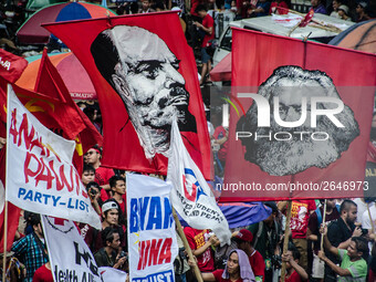 Activists wave images of Karl Marx and Vladimir Lenin during the Labor Day Protest in Mendiola street, Manila, Philippines, on 1st May 2018....