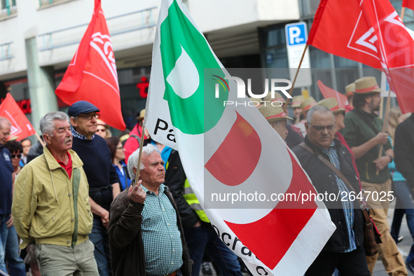 Man with a flag of the Italian governing party Partito Democratico (PD). Several thousands followed the invitation of the trade unions such...