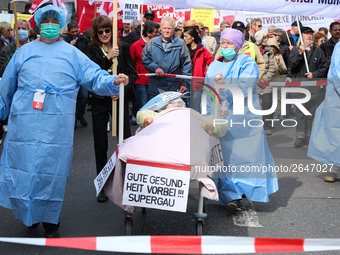 Activists making aware of the heavy problems in the health industry. Several thousands followed the invitation of the trade unions such as I...