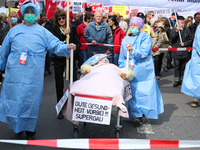 Activists making aware of the heavy problems in the health industry. Several thousands followed the invitation of the trade unions such as I...