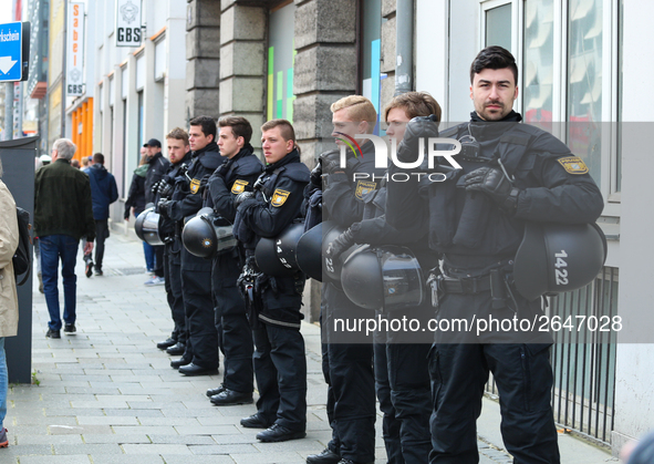 Riot police looks at the demonstration. Several thousands followed the invitation of the trade unions such as IG Metall, Verdi, GEW and othe...