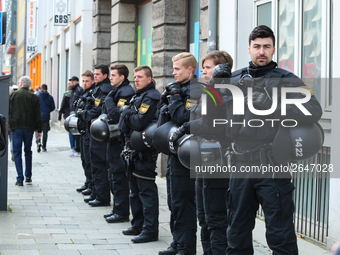 Riot police looks at the demonstration. Several thousands followed the invitation of the trade unions such as IG Metall, Verdi, GEW and othe...