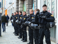 Riot police looks at the demonstration. Several thousands followed the invitation of the trade unions such as IG Metall, Verdi, GEW and othe...