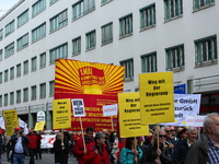 ommunists with a huge banner. Several thousands followed the invitation of the trade unions such as IG Metall, Verdi, GEW and others to prot...