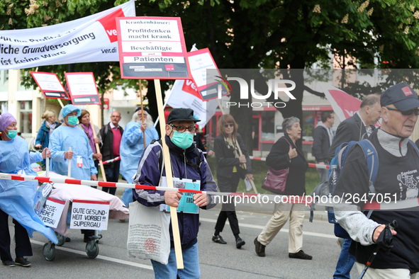 A man protests against the working situation in the hospitals. Several thousands followed the invitation of the trade unions such as IG Meta...