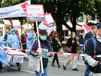 A man protests against the working situation in the hospitals. Several thousands followed the invitation of the trade unions such as IG Meta...