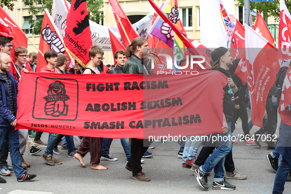 The youth organisation of the governing Social Democratic Party of Germany (SPD) JuSo with a banner against Racism, Sexism, and capitalism....