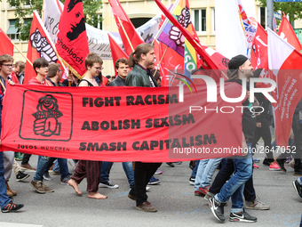 The youth organisation of the governing Social Democratic Party of Germany (SPD) JuSo with a banner against Racism, Sexism, and capitalism....