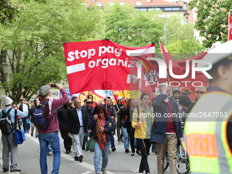 Protestors carry banners against the new Poliziaufgabengesetz of the CSU party as a policeman looks at them. Several thousands followed the...