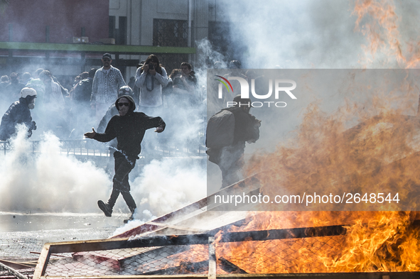 View of a fire during clashes following a May Day march in Santiago on May 1, 2018. The clashes between demonstrators and carabineros of the...