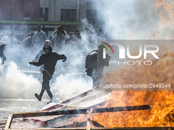 View of a fire during clashes following a May Day march in Santiago on May 1, 2018. The clashes between demonstrators and carabineros of the...