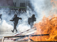 View of a fire during clashes following a May Day march in Santiago on May 1, 2018. The clashes between demonstrators and carabineros of the...