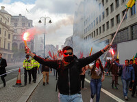 Kurdish protesters set off Flares at Mayday . International Workers Day in London kicked off with a march through Central London and ended i...