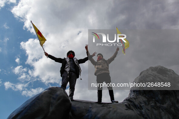 Protesters wave flags as thousands take part in the London May Day March and Rally in Trafalgar square in London on May 1, 2018. Internation...