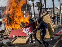 View of a fire during clashes following a May Day march in Santiago on May 1, 2018.  The clashes between demonstrators and carabineros of th...