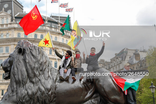 Protesters wave flags as thousands take part in the London May Day March and Rally in Trafalgar square in London on May 1, 2018. Internation...