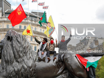 Protesters wave flags as thousands take part in the London May Day March and Rally in Trafalgar square in London on May 1, 2018. Internation...