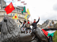 Protesters wave flags as thousands take part in the London May Day March and Rally in Trafalgar square in London on May 1, 2018. Internation...