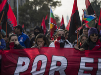 Demonstrators clash with riot police following a May Day march in Santiago on May 1, 2018.  The clashes between demonstrators and carabinero...