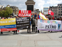 Mayday Marchers call to free Julian Assange . International Workers Day in London kicked off with a march through Central London and ended i...