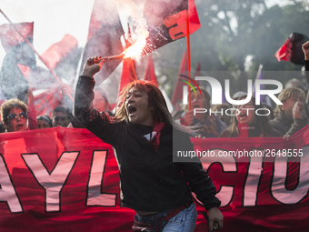 Demonstrators clash with riot police following a May Day march in Santiago on May 1, 2018. The clashes between demonstrators and carabineros...