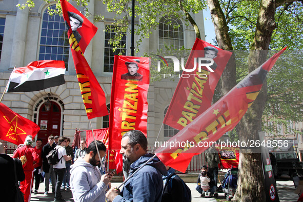 Partizan Flags at Mayday In London . International Workers Day in London kicked off with a march through Central London and ended in Trafalg...