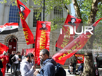 Partizan Flags at Mayday In London . International Workers Day in London kicked off with a march through Central London and ended in Trafalg...