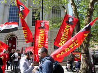 Partizan Flags at Mayday In London . International Workers Day in London kicked off with a march through Central London and ended in Trafalg...