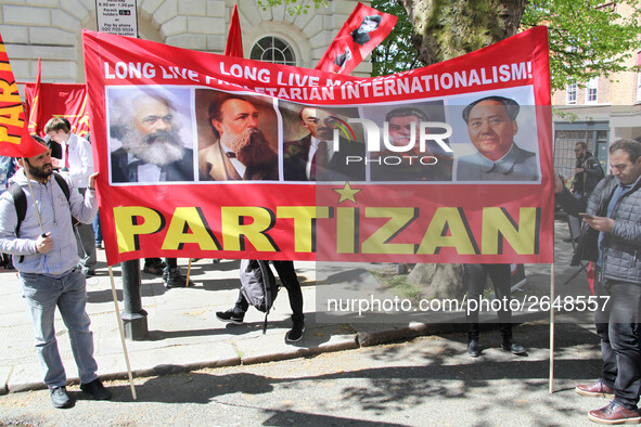 Partizan Flags at Mayday In London . International Workers Day in London kicked off with a march through Central London and ended in Trafalg...