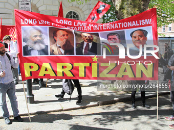 Partizan Flags at Mayday In London . International Workers Day in London kicked off with a march through Central London and ended in Trafalg...