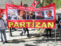 Partizan Flags at Mayday In London . International Workers Day in London kicked off with a march through Central London and ended in Trafalg...