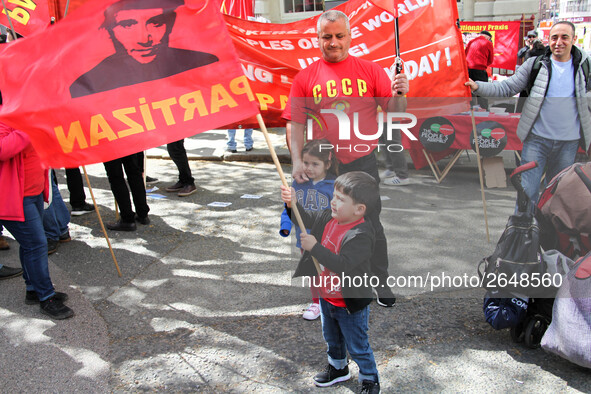 Child with Partizan Flag . International Workers Day in London kicked off with a march through Central London and ended in Trafalgar Square...